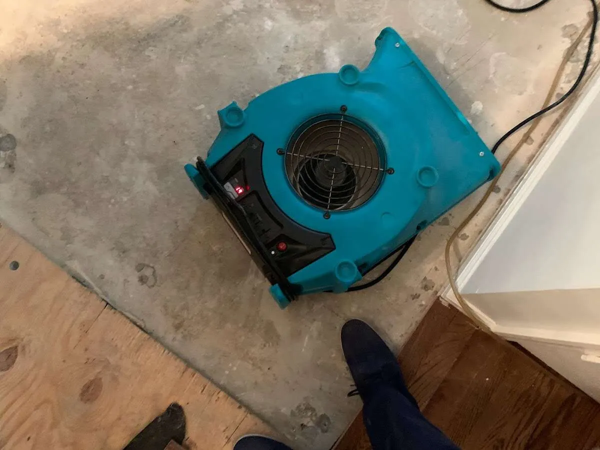 Air mover drying subfloor during Leak Detection & Repair in Krum